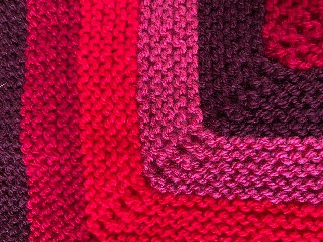 colourful knitted square close up