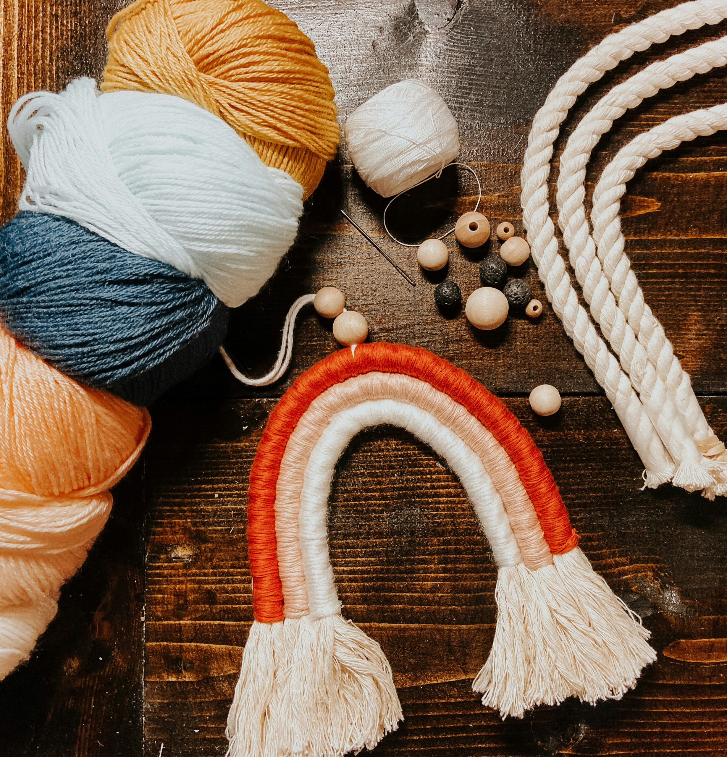 Macrame key ring and crafting materials on a table